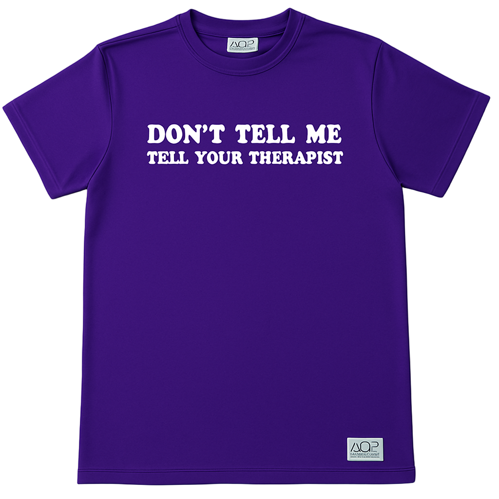 Don’t Tell Me, Tell Your Therapist mental health graphic tee on a blue shirt with white text, relaxed fit design, promoting self-care and boundaries.