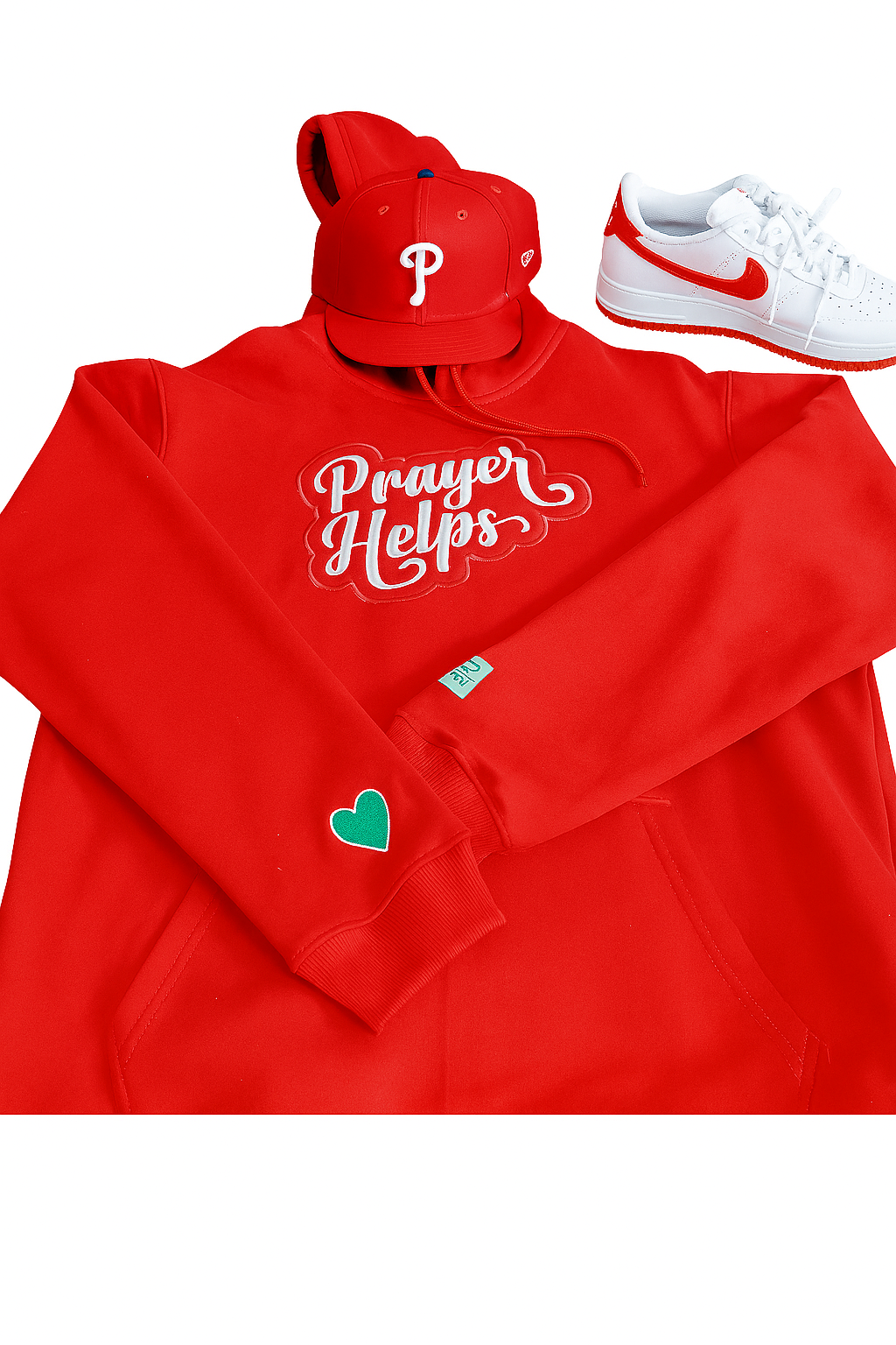 Red hoodie with 'Prayer Helps' text, red cap with white logo, and white sneakers on a white background