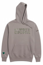 A light gray pullover hoodie with 'MY ENERGY IS EXPENSIVE' printed across the chest in a distressed green and gray pattern. It features a green heart patch on the left sleeve and a small script logo on the right sleeve.